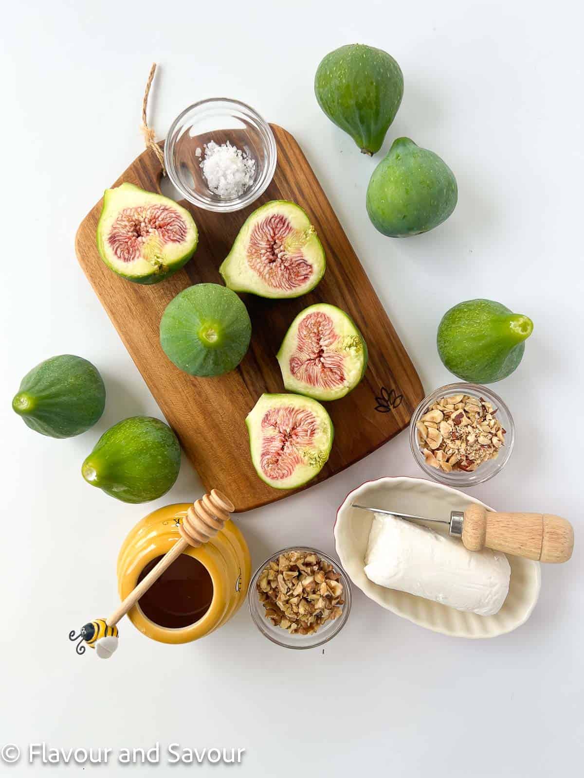 Ingredients for fresh fig appetizer with goat cheese and honey.
