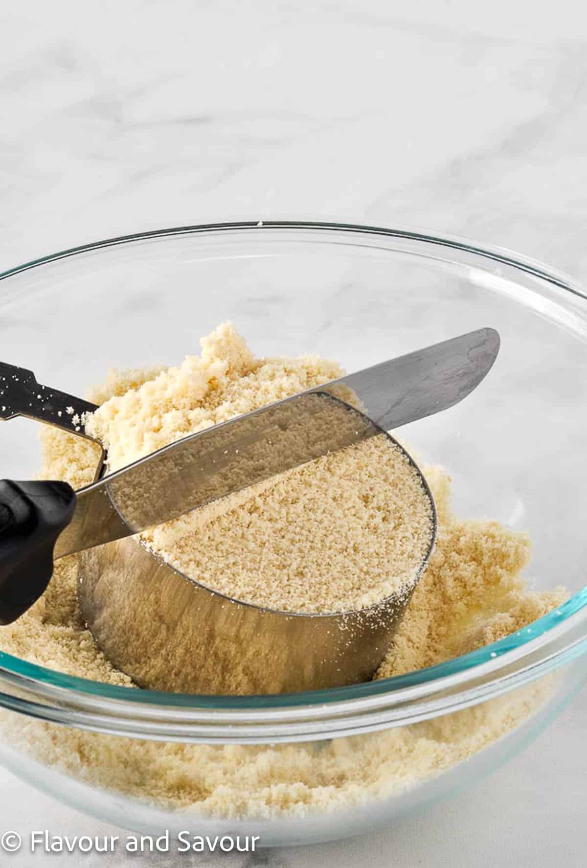 Measuring almond flour using the spoon and level method.