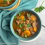 A bowl of lentil and sausage stew.