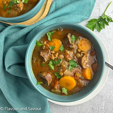 A bowl of lentil and sausage stew.