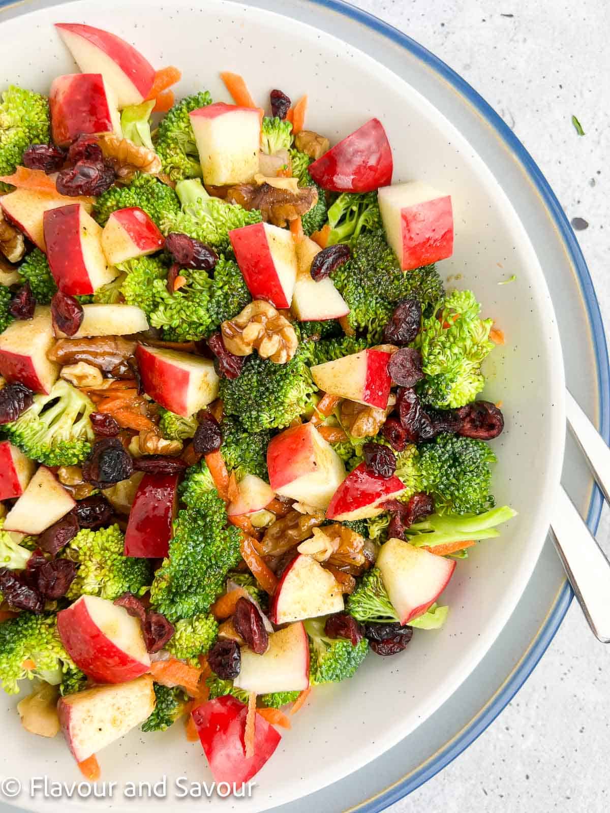 Closeup view of broccoli apple salad with maple balsamic dressing.