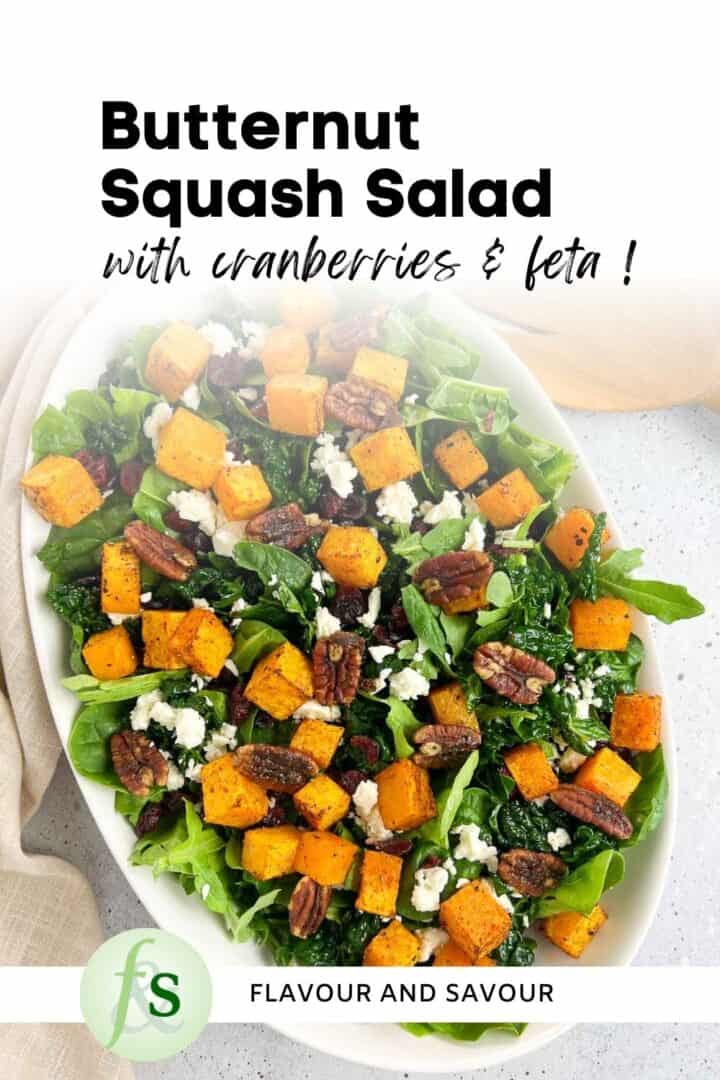 Image with text overlay for butternut squash salad with cranberries, feta cheese and pumpkin spice pecans.