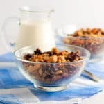 A small glass bowl with cherry vanilla grain-free granola.