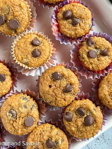 Square image of mini gluten-free pumpkin muffins with chocolate chips.