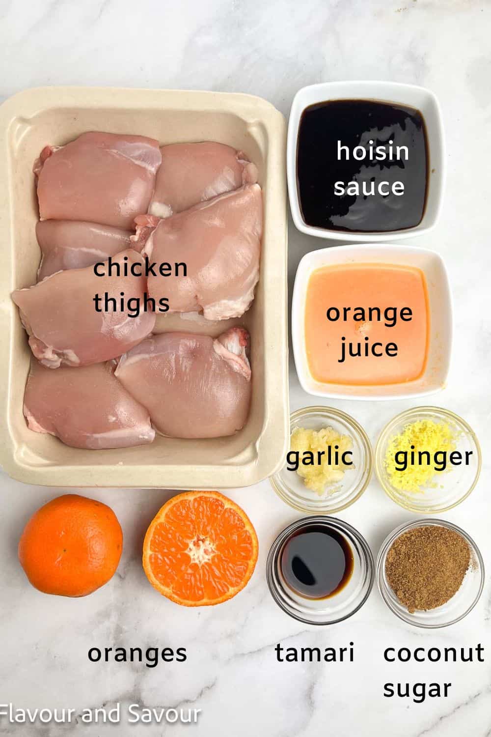 Ingredients for hoisin orange glazed chicken thighs: chicken, hoisin sauce, orange juice, ginger, garlic, tamari, coconut sugar, and oranges.