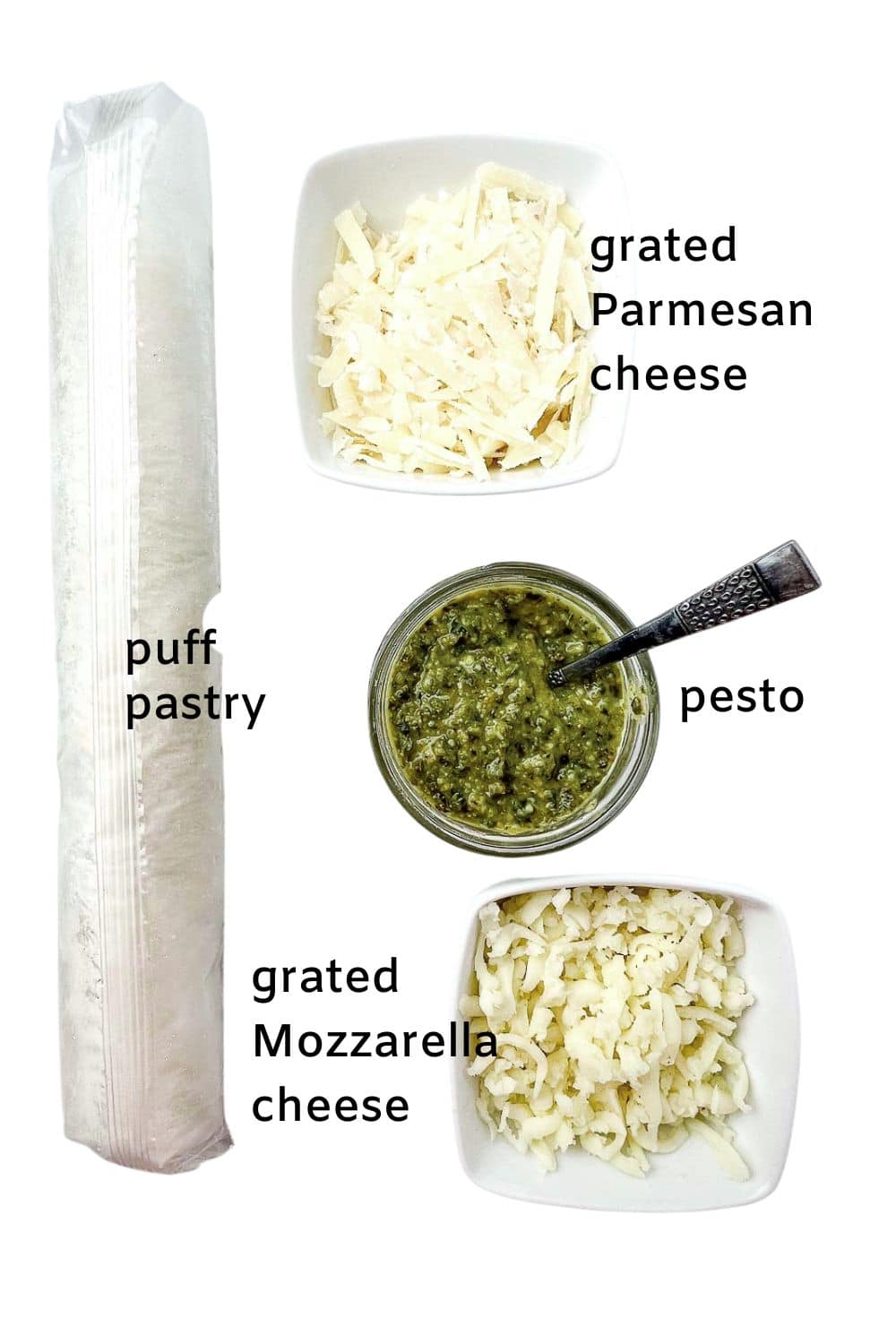 Labelled ingredients for puff pastry pesto pinwheels: puff pastry, grated Parmesan, pesto sauce, and grated Mozzarella cheese.