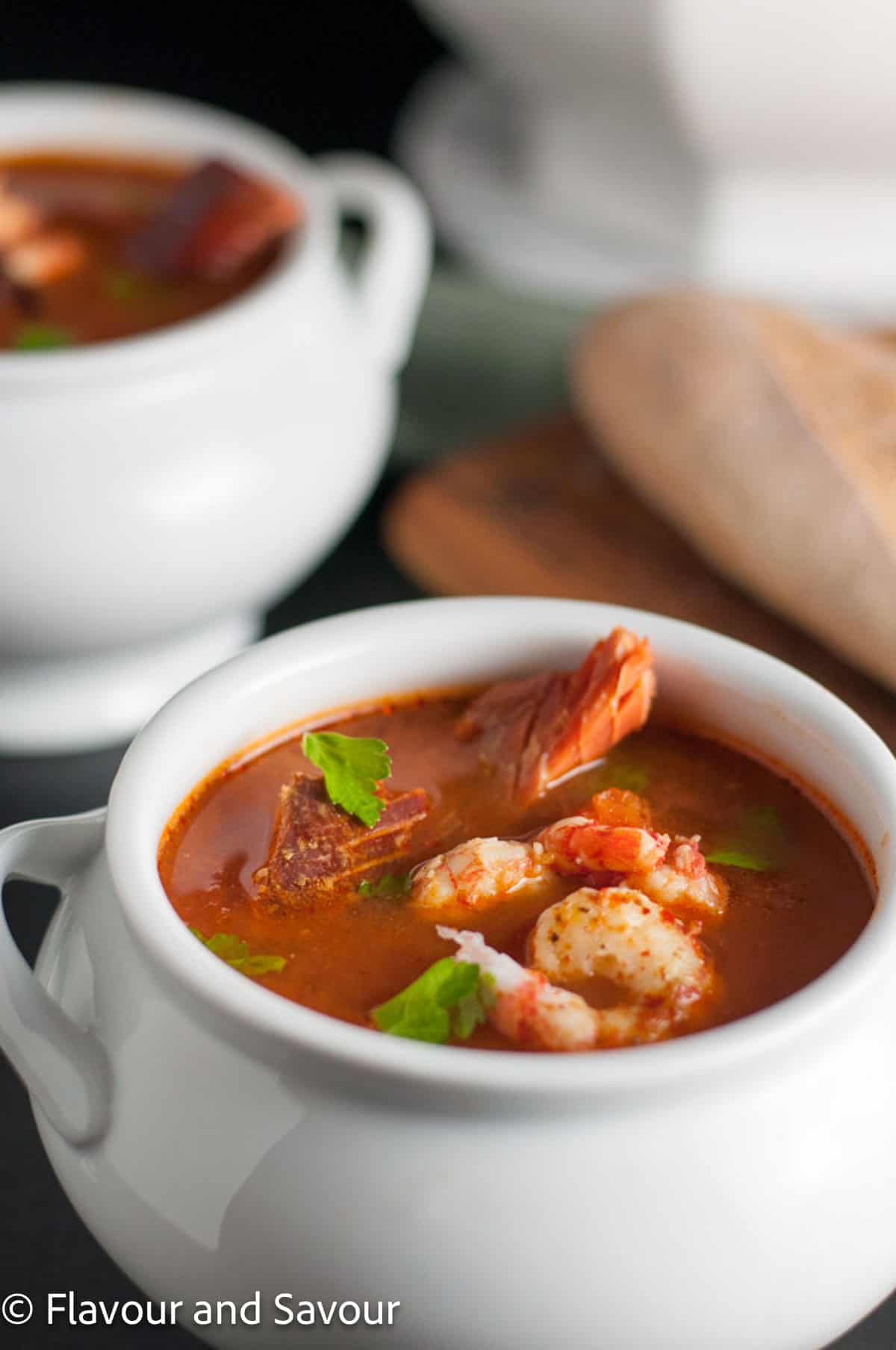 Fishermen's stew or cioppino in a white soup tureen.