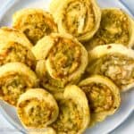 Puff pastry pesto pinwheels on a plate.