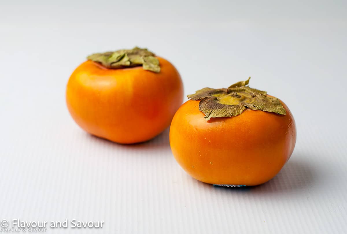 Two Fuyu persimmons