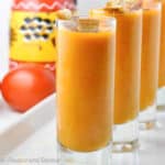 Shot glasses filled with Salmorejo, Spanish chilled tomato soup.