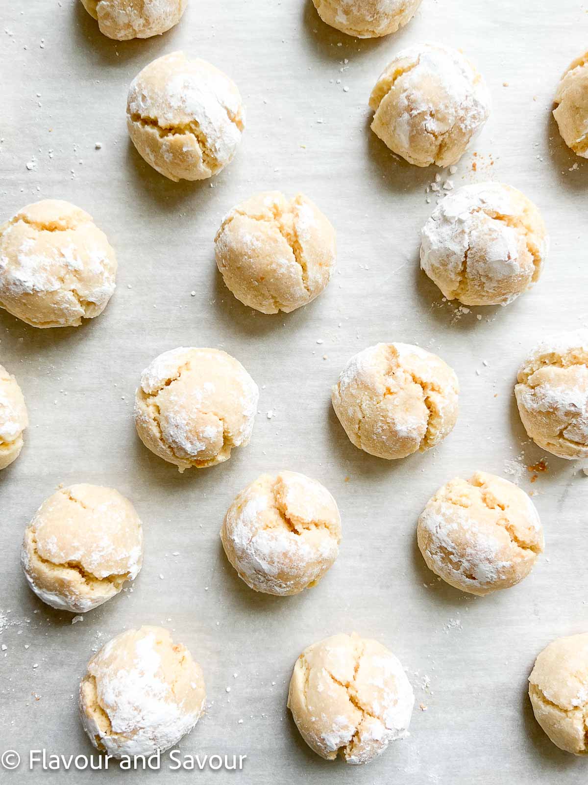 Italian amaretti cookies on a baking sheet.