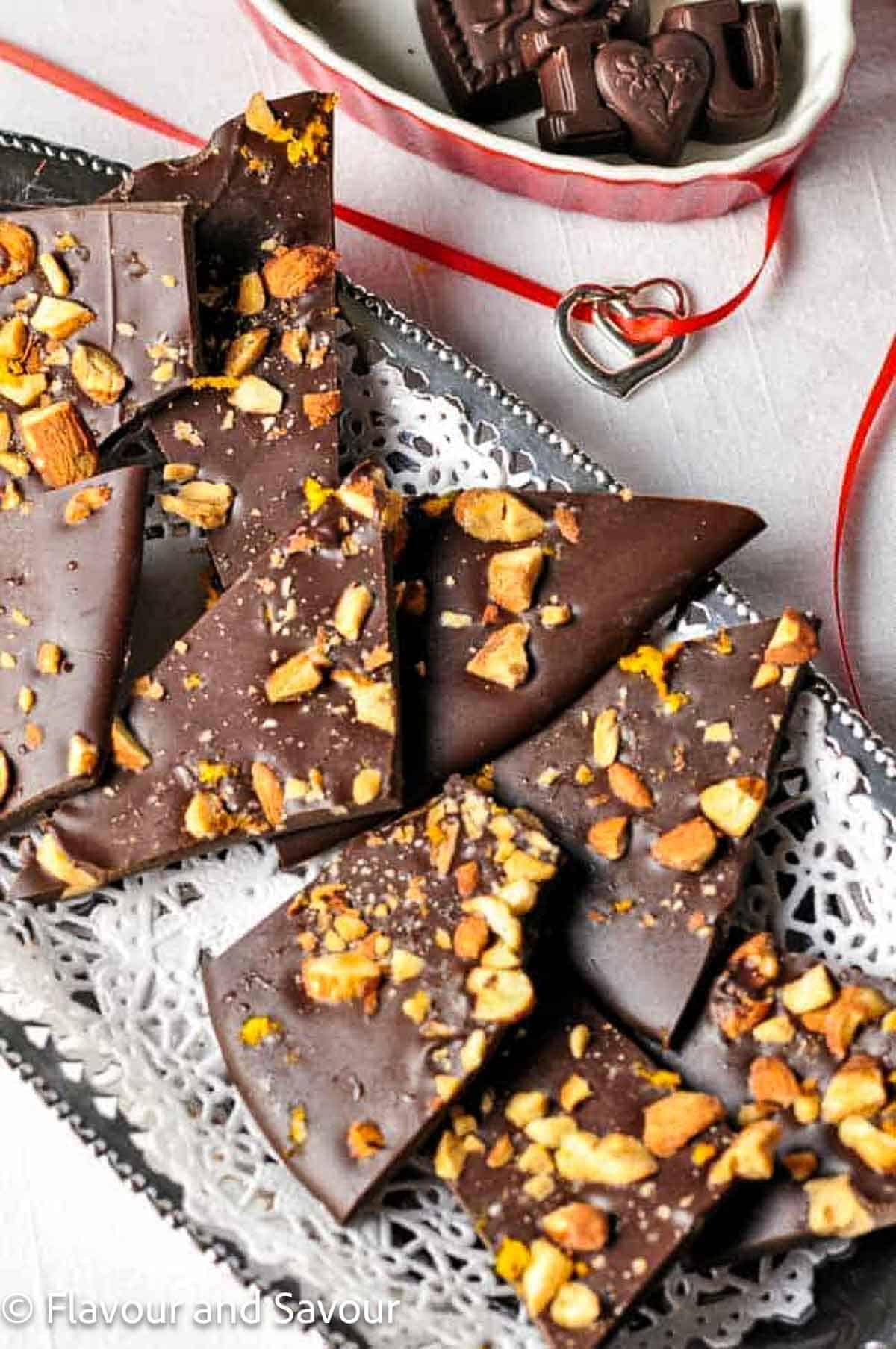 Orange and almond chocolate bark on a silver tray.