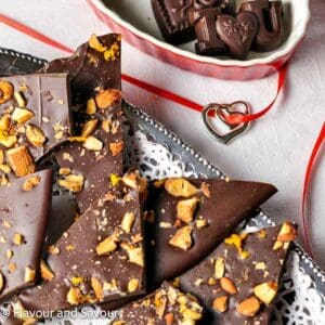 Orange and almond chocolate bark on a silver tray.