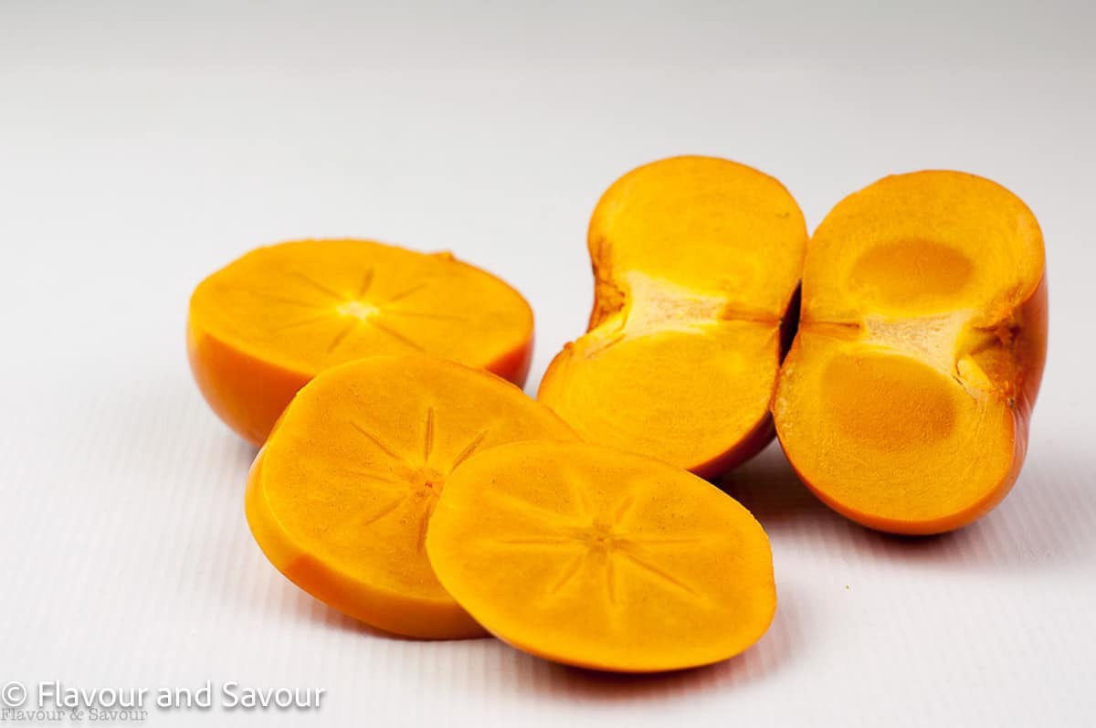 Persimmons, cutt o show the inside of the fruit.