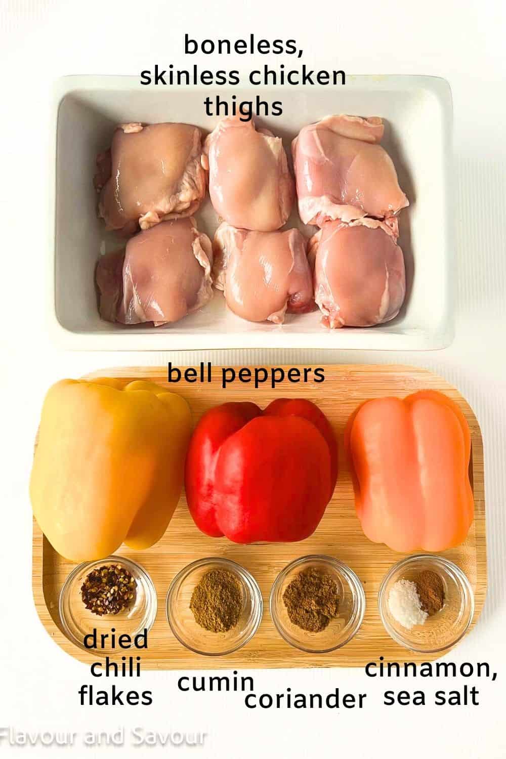 Labelled ingredients for Moroccan style chicken with peppers: boneless skinless chicken thighs, bell peppers, dried chili flakes, cumin, coriander, cinnamon, sea salt.