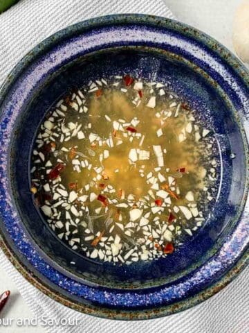 A bowl of Nuoc Cham, Vietnamese dipping sauce.