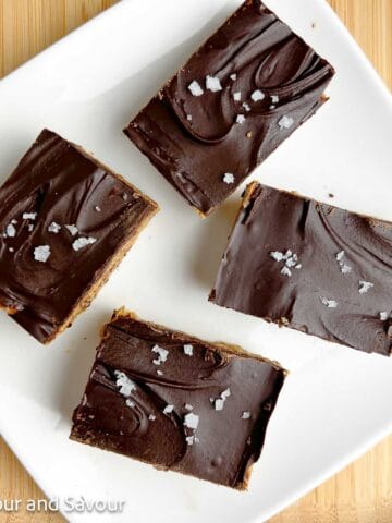 Peanut butter collagen bars on a white plate.