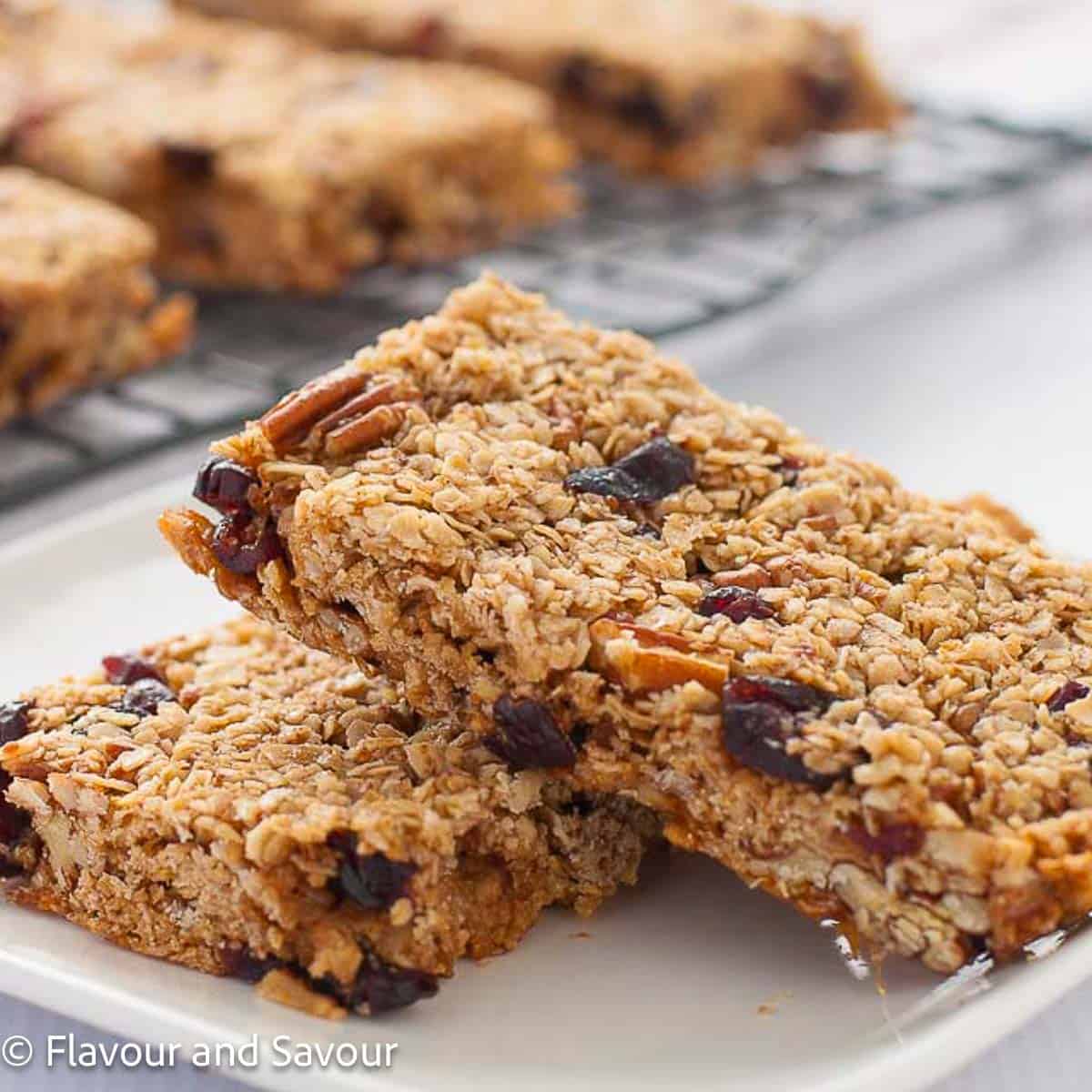 Chewy Cranberry Pecan Oat Bars stacked.