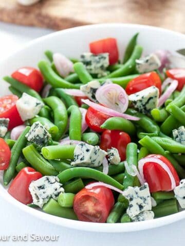 Green bean salad with blue cheese and cherry tomatoes.