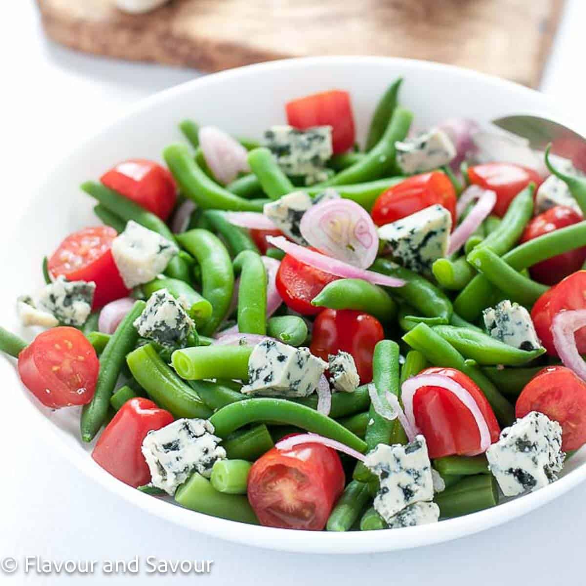 Green bean salad with blue cheese and cherry tomatoes.