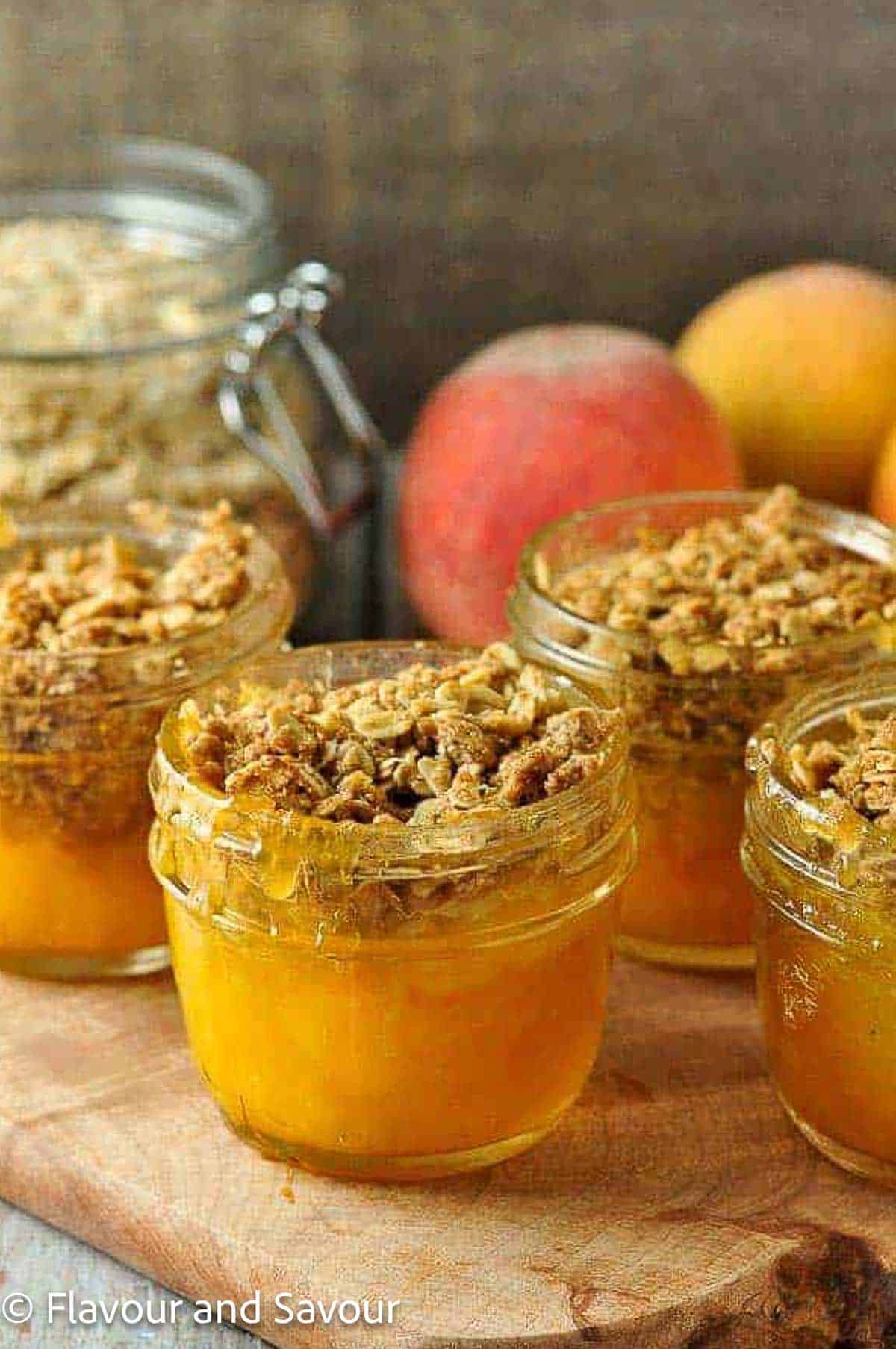 Small ½ cup jars with mini peach crisp.