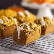 Mini pumpkin loaves on a cooling rack.