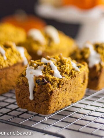 Mini pumpkin loaves on a cooling rack.