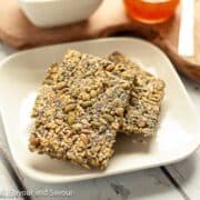 Oat crackers stacked on a plate.