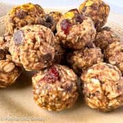 No-bake energy balls made with rolled oats, hemp hearts, chocolate chips and dried cranberries.
