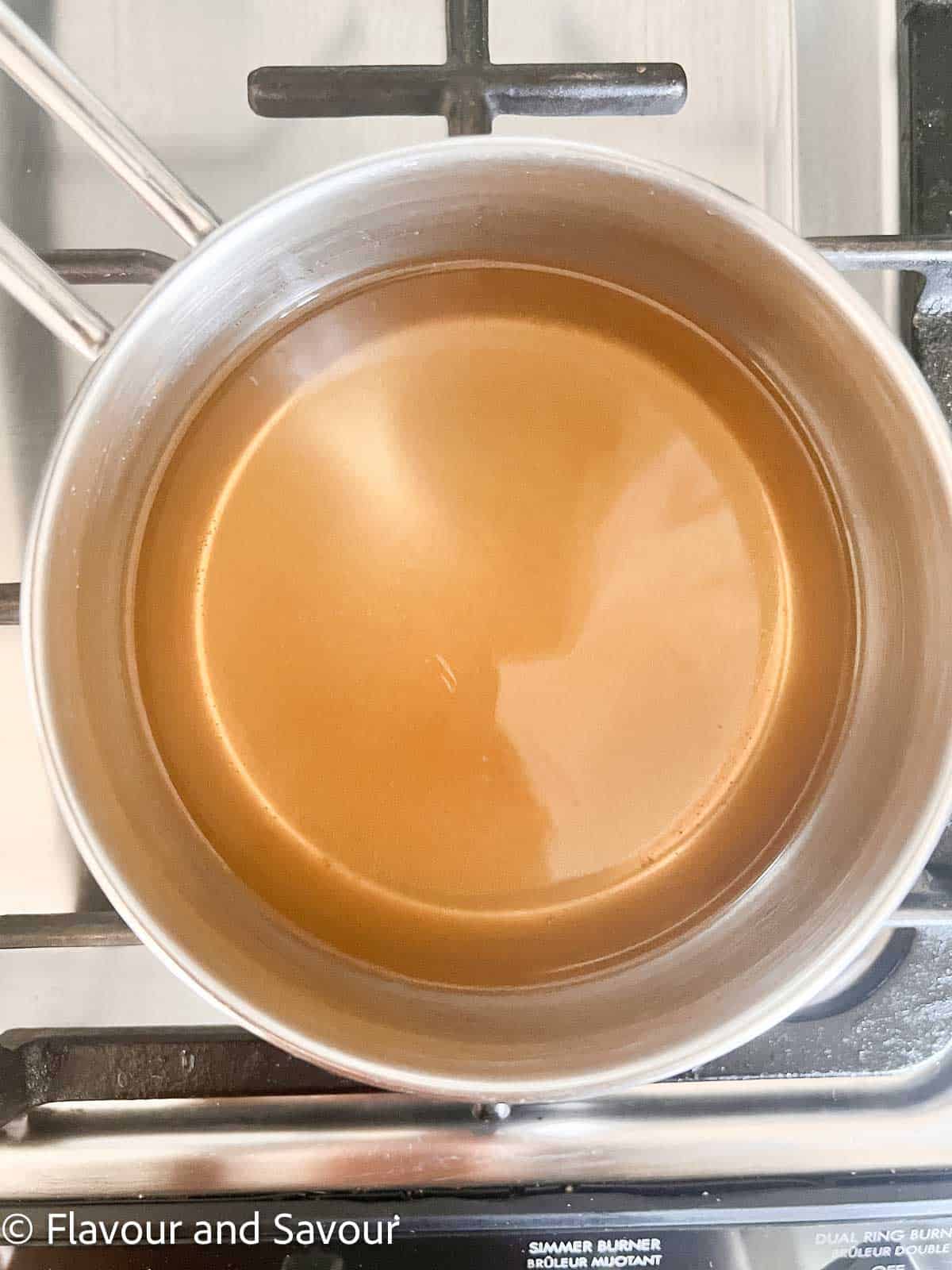 Pickling brine in a saucepan on the stovetop.