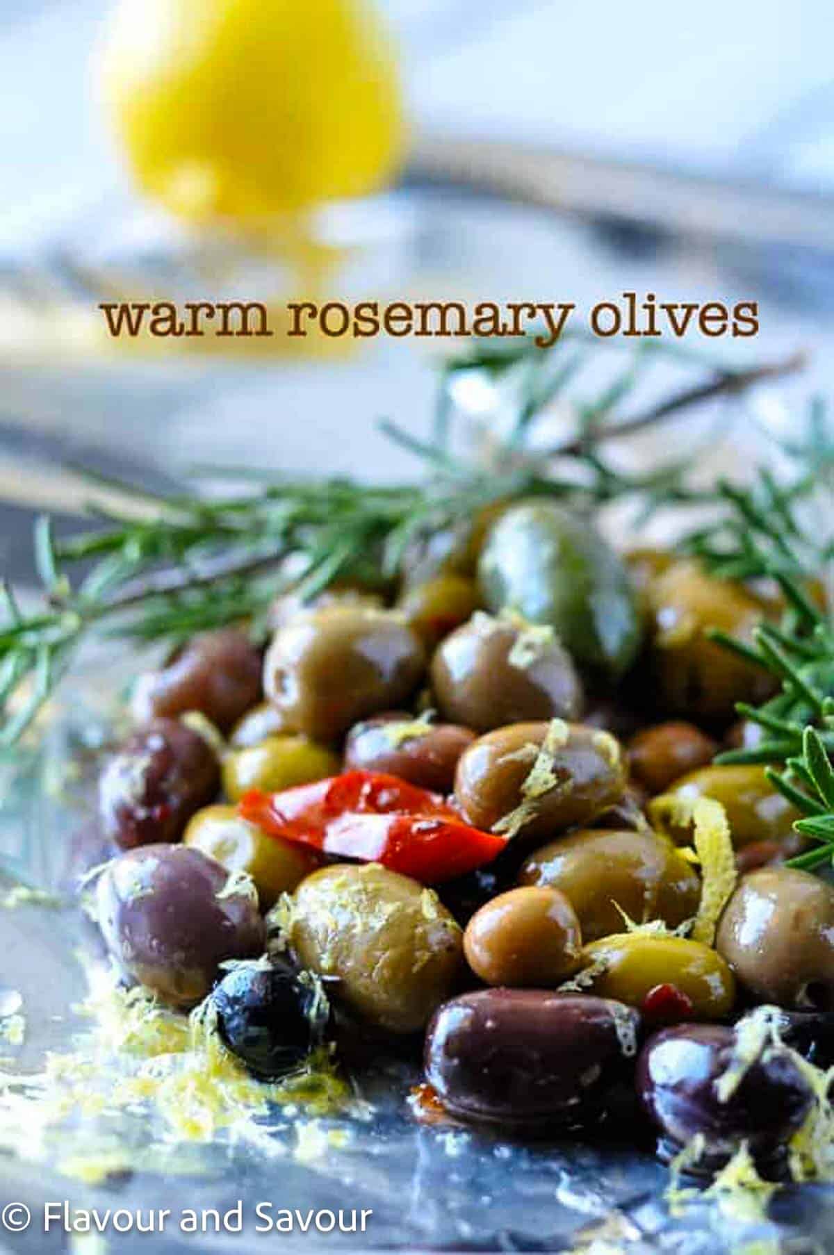 Warm rosemary olives with title text.